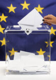 transparent-ballot-box-filled-with-white-envelope-european-union-flag-front-view